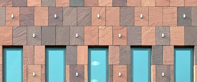 Close-up of the stone facade of the MAS museum (Museum aan de Stroom) on the Eilandje, Antwerp